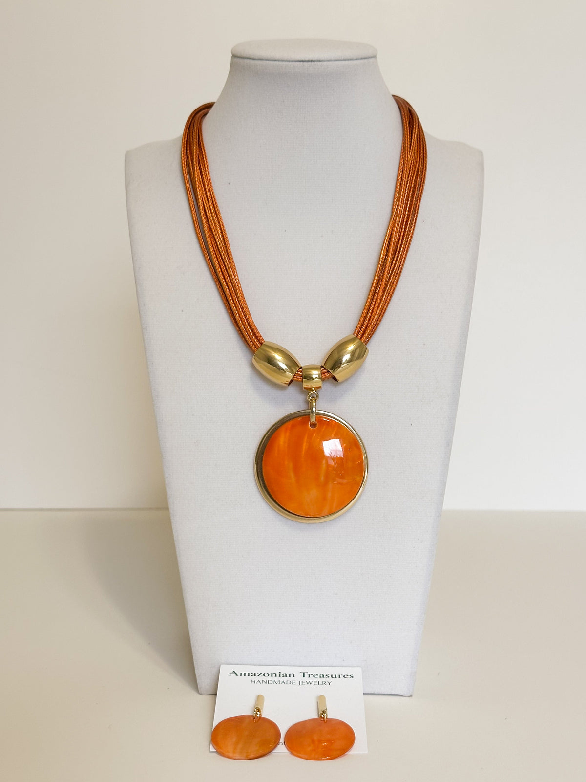 Mother of pearl earrings and necklace handcrafted by an independent Brazilian artisan
