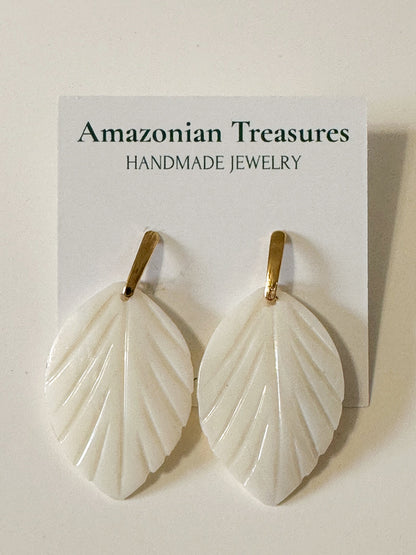 Mother of pearl leaf earrings handcrafted by an Amazon artisan.