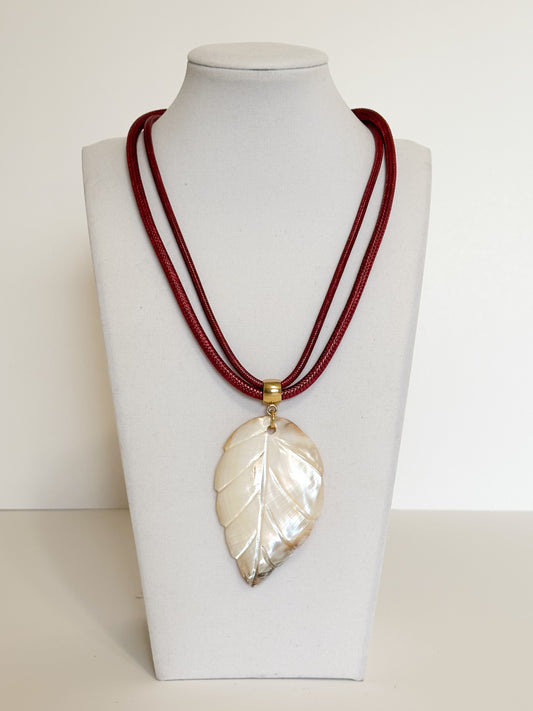 Mother of pearl leaf necklace with rope cord handcrafted by Brazilian artisan.