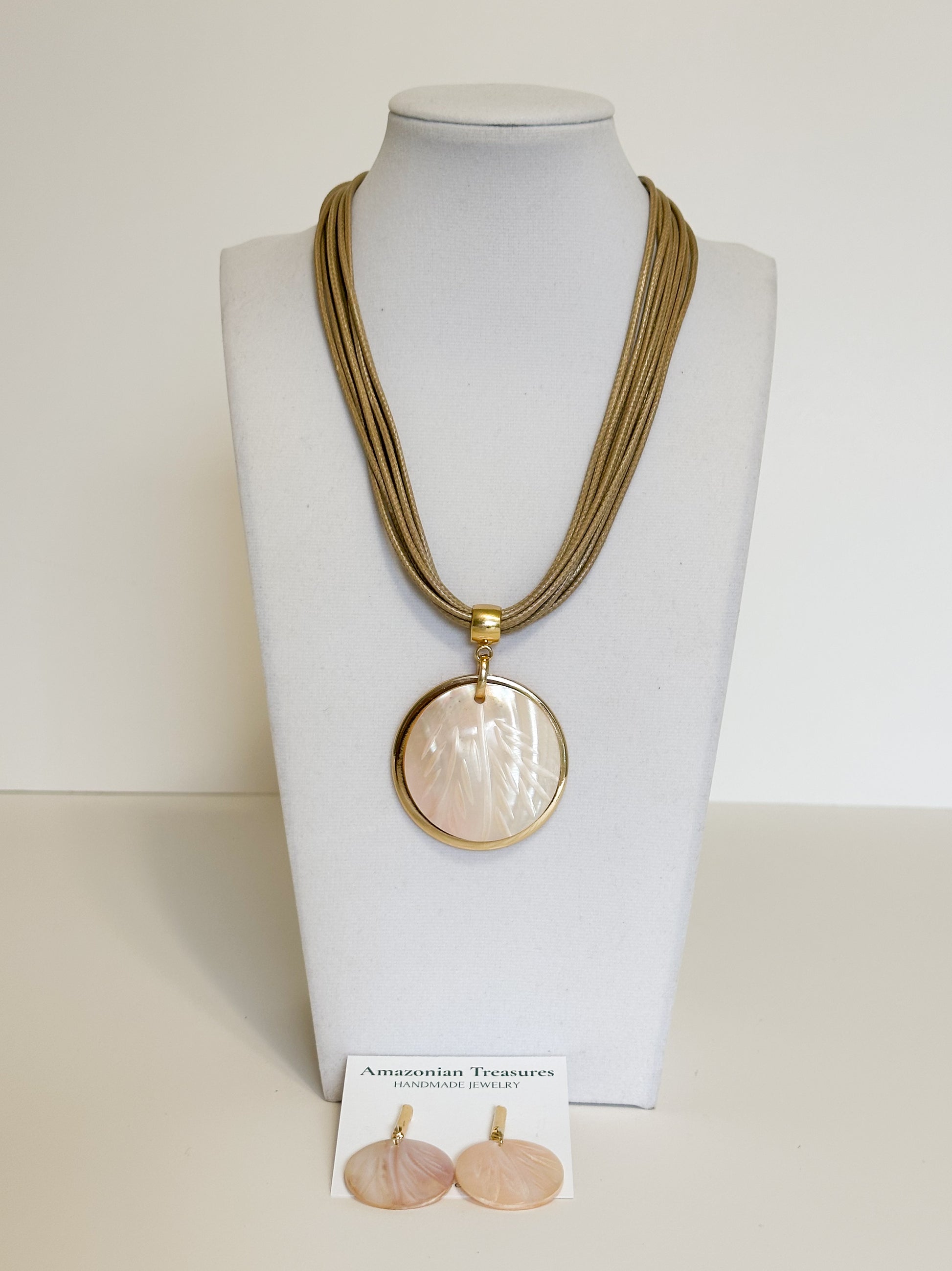 Close-up of mother of pearl necklace and earrings handcrafted in Brazil from the freshwaters of the Amazon river.
Suggested for image