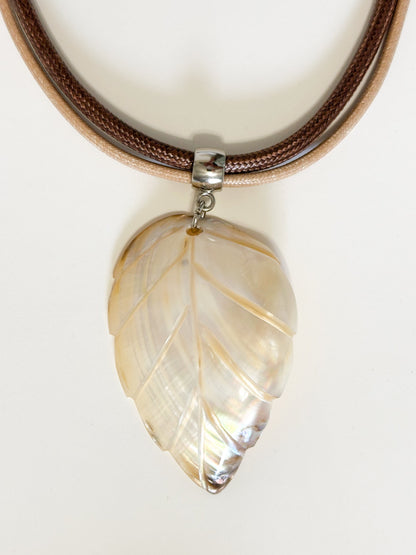 Mother of pearl shell leaf pendant carved from Amazon river shell. Light white