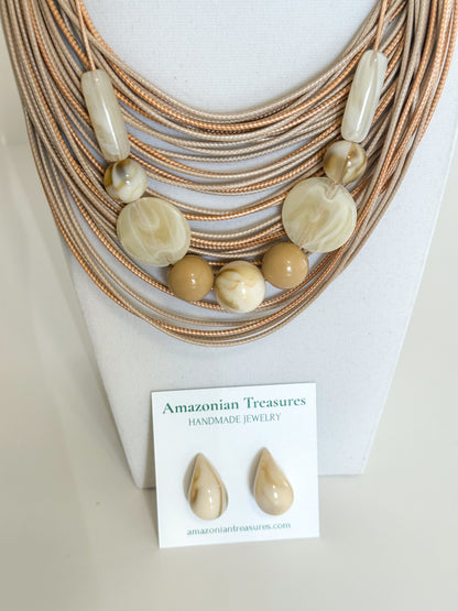 Multi-strand cotton necklace with resin beads and matching resin earrings.