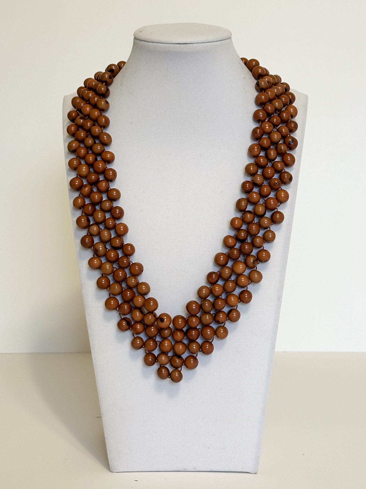 Multi-strand necklace made with dyed açaí seeds handcrafted by Brazilian artisans. Brown