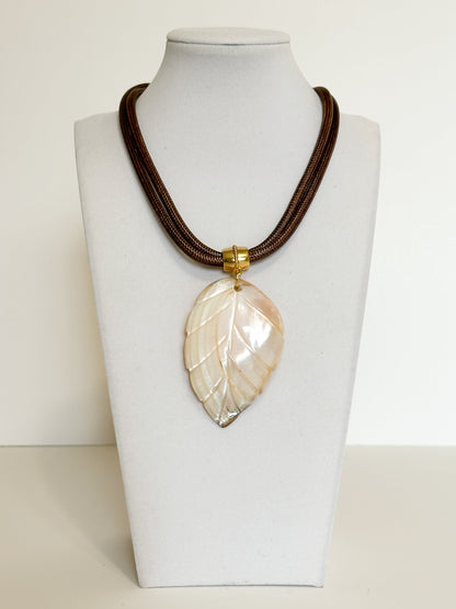 Natural mother of pearl leaf pendant necklace with layered rope cord.