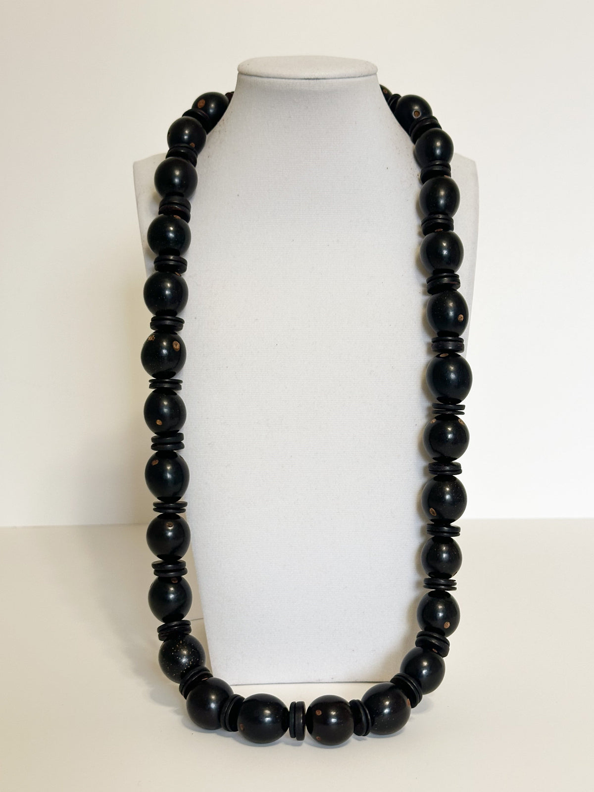 Natural tucumã seed necklace with colorful accents and coconut shell beads. Black