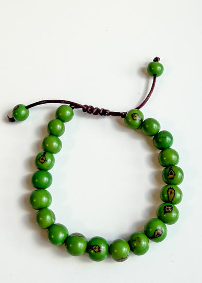 Nature-crafted Amazon seed bracelet green detail