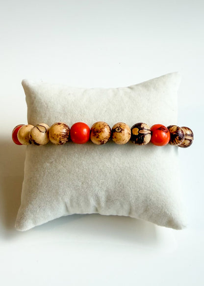 Nature-crafted Amazon seed bracelet orange 