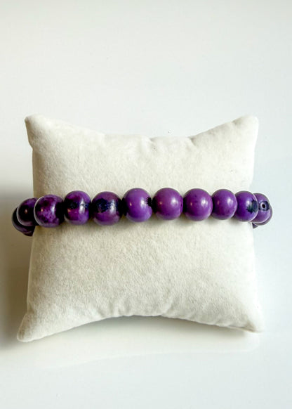 Nature-crafted Amazon seed bracelet purple