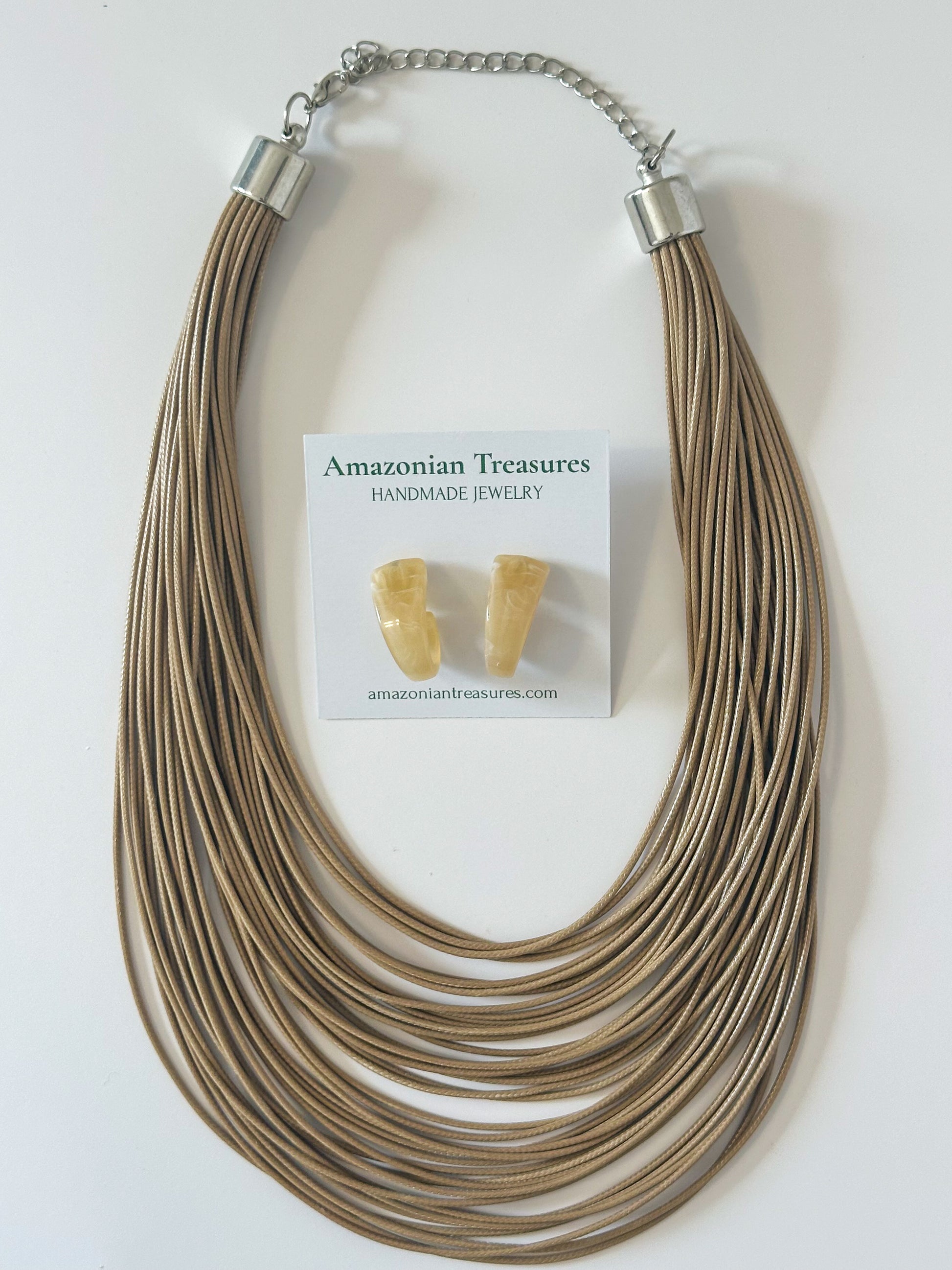 Neutral layered cotton necklace with matching resin earrings.