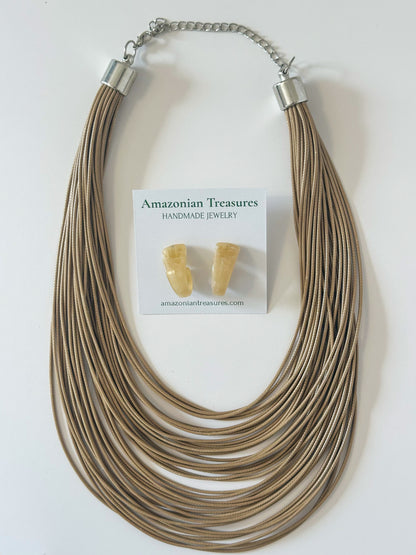 Neutral layered cotton necklace with matching resin earrings.