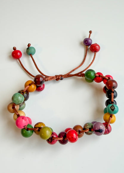 Orange and multicolor artisan Açaí seed bracelets handmade in Brazil