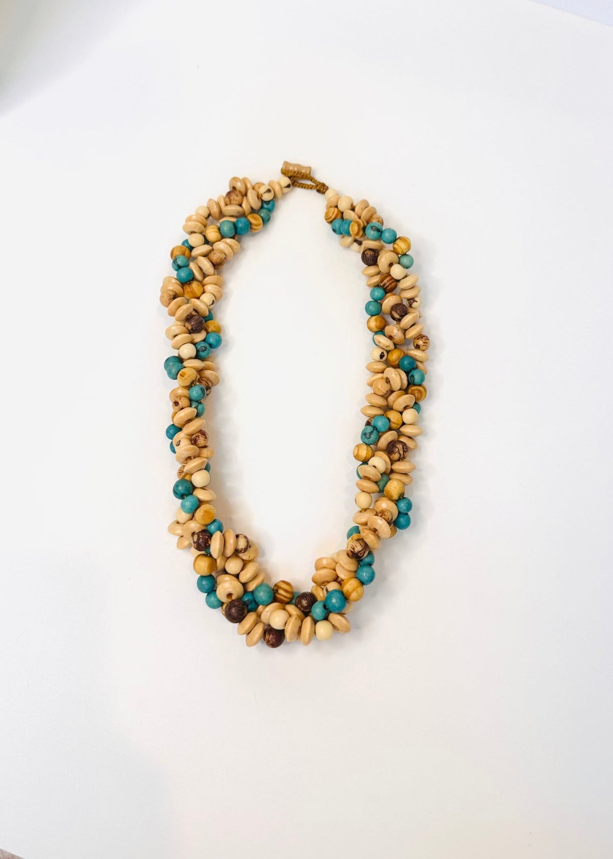 Handmade Amazon necklace with reclaimed wood and natural açaí seeds
