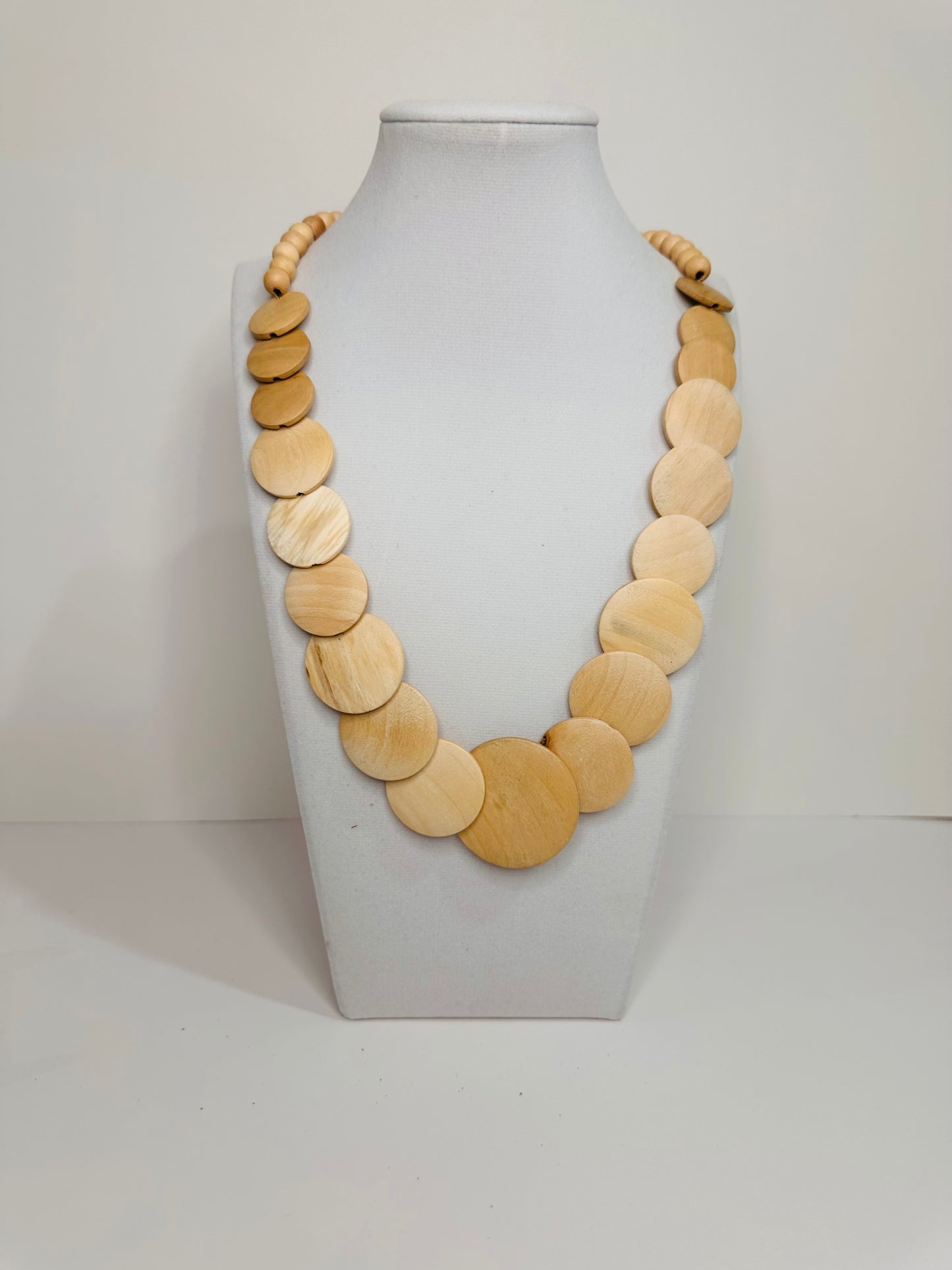 Reclaimed wood necklace handcrafted in Brazil with natural round wood pieces