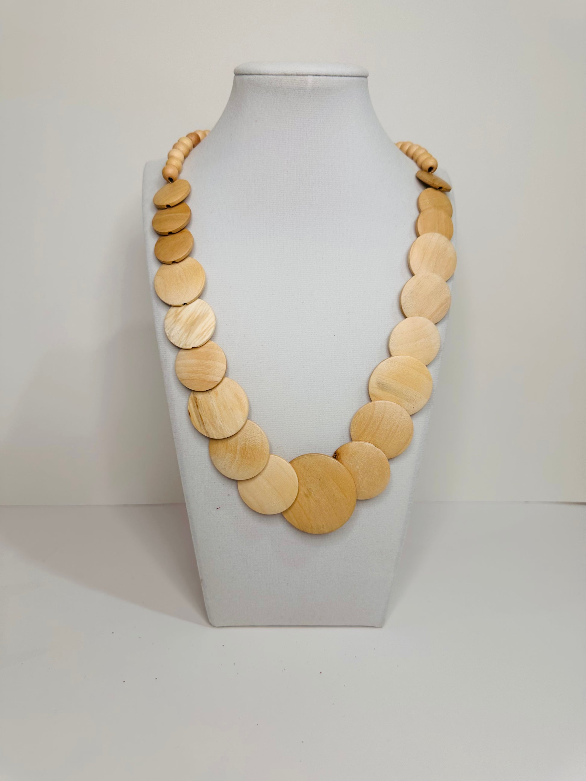 Reclaimed wood necklace handcrafted in Brazil with natural round wood pieces