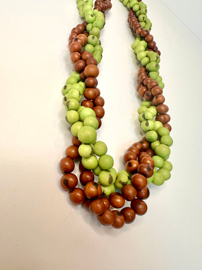 Necklace with green and brown acai beads details