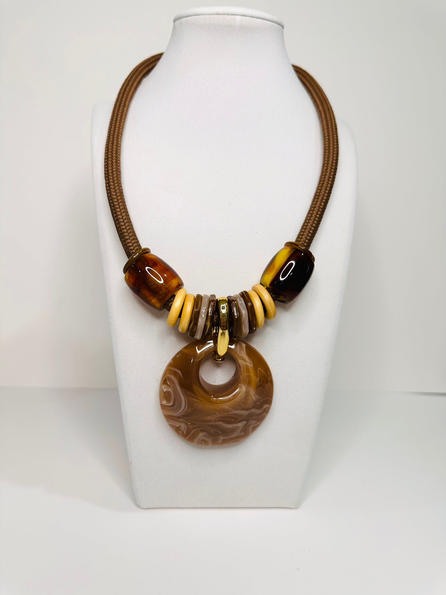 Urban Flow resin necklace set featuring oversized circular pendant on rope cord with matching statement earrings. brown
