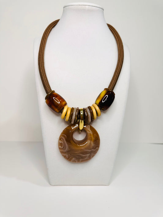 Urban Flow resin necklace set featuring oversized circular pendant on rope cord with matching statement earrings. brown
