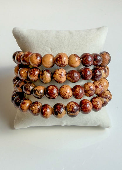 Wide multi-row Açaí seed bracelet handmade by an artisans association in Brazil