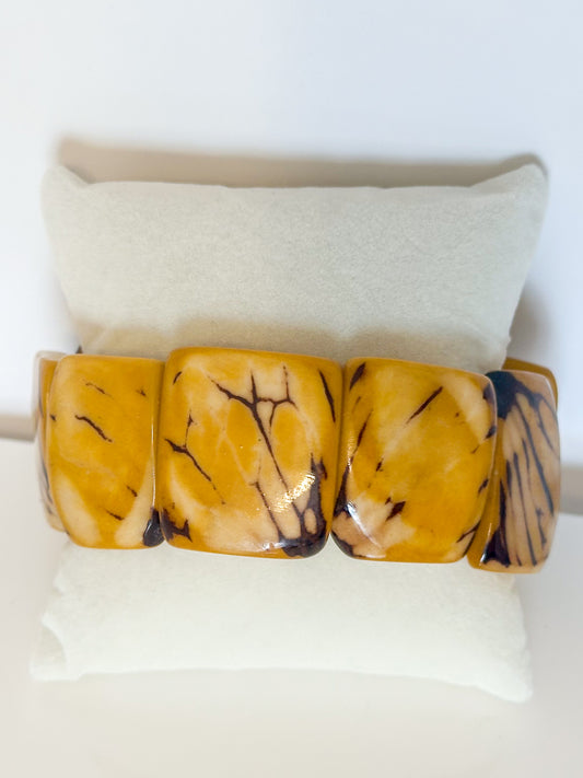 Yellow dyed jarina seed stretch bracelet made from Amazon tagua.