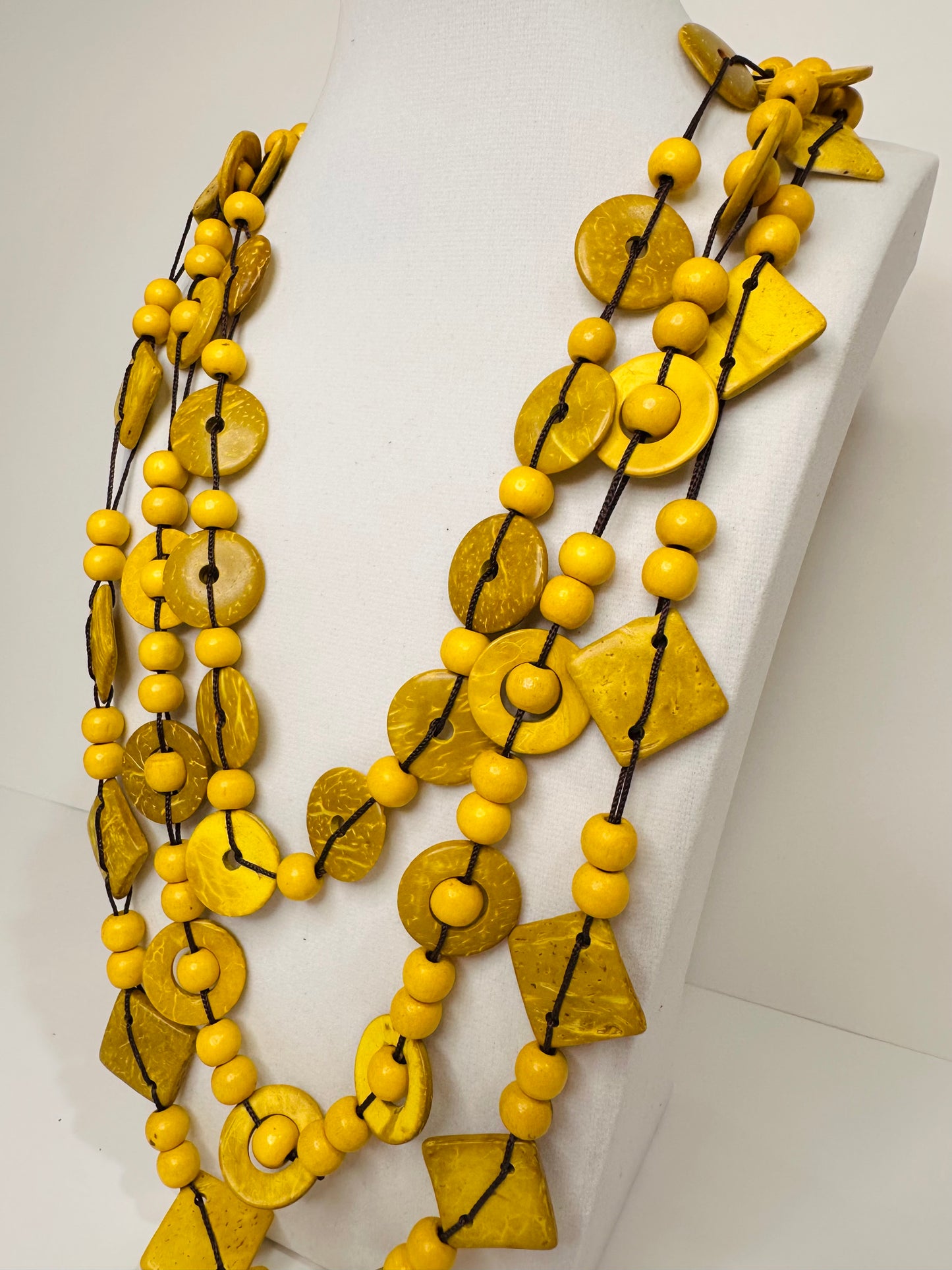Yellow layered Amazon seed statement necklace detail