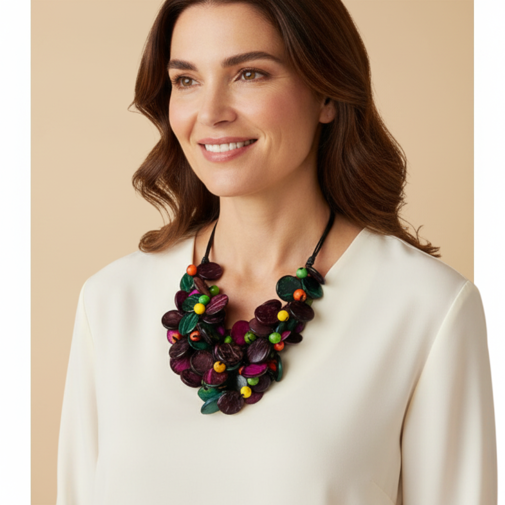 Amazonian Treasures Eco Chaveirinho necklace featuring colorful polished acai seeds and coconut fiber on a woman
