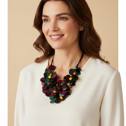 Amazonian Treasures Eco Chaveirinho necklace featuring colorful polished acai seeds and coconut fiber on a woman