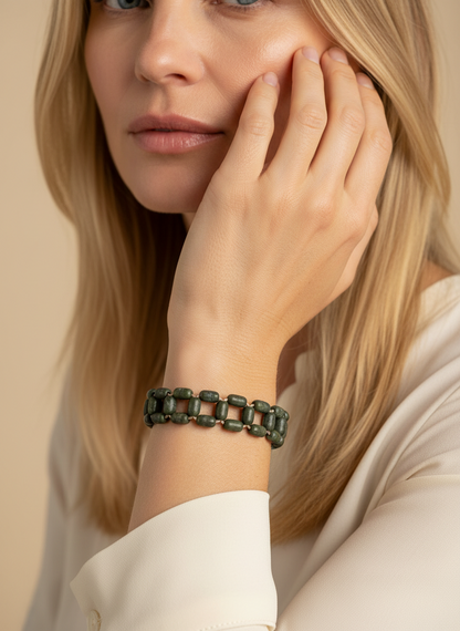 Amazonian Treasures Açaí Mosaic Bracelet featuring dark green handwoven seeds in a geometric pattern on a woman's wrist