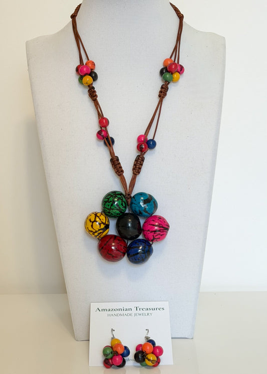 Amazonian Treasures Amazon Roots Set featuring a colorful acai seed necklace and matching earrings on a display bust.
