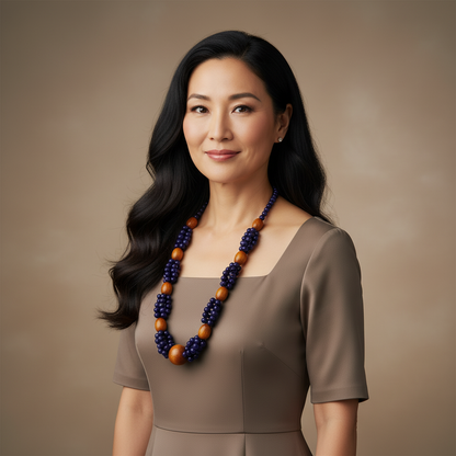 Amazonian Treasures Forest Roots necklace featuring polished blue açaí seeds and natural wood beads on a woman