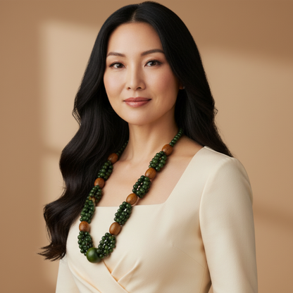 Amazonian Treasures Forest Roots necklace featuring green açaí seeds and natural wood beads worn by a woman.