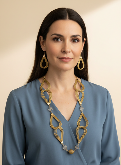 Amazonian Treasures Golden Breeze necklace and earrings set made of handwoven golden grass with white stone accents.
