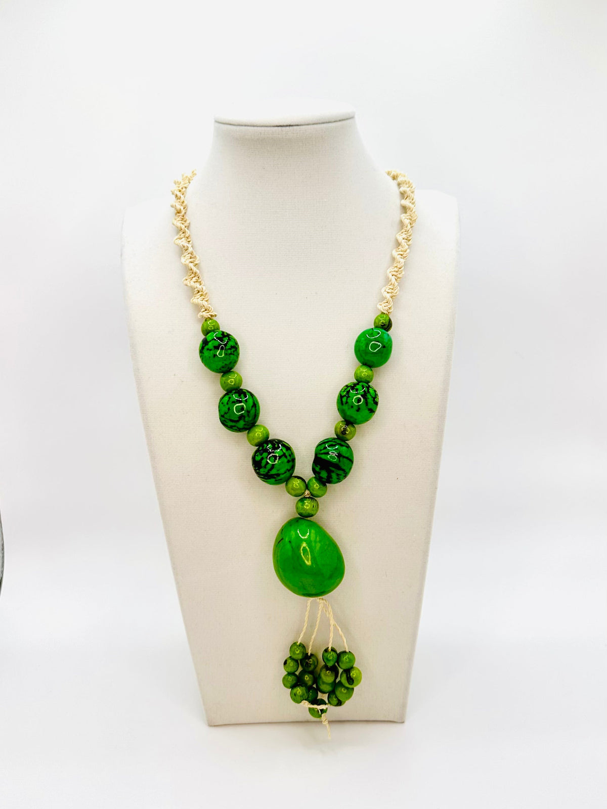 Amazonian Treasures statement necklace featuring green jarina and açaí seeds on woven tucum fiber cord.