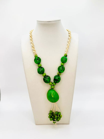 Amazonian Treasures statement necklace featuring green jarina and açaí seeds on woven tucum fiber cord.