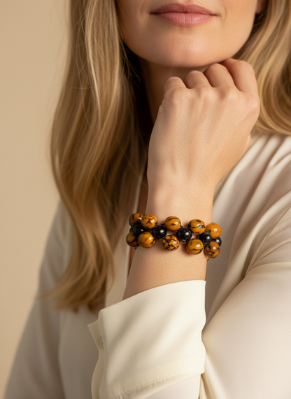Amazonian Treasures Terra marbled bracelet featuring golden-brown soap seeds and dark Caranã beads on a woman's wrist.