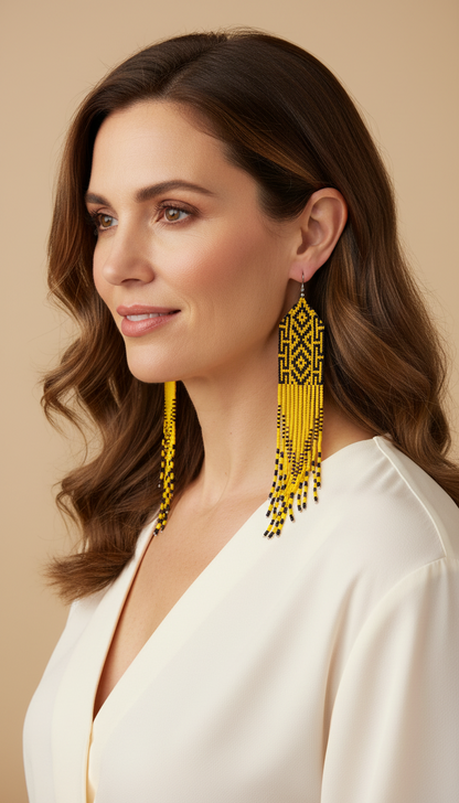 Amazonian Treasures Wai Wai handmade long fringe earrings with yellow and black recycled glass bead diamond pattern.