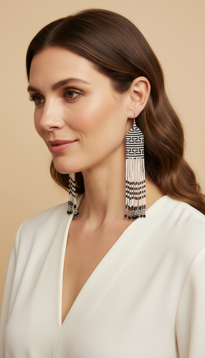 Amazonian Treasures Wai Wai Meander fringe earrings featuring black and white geometric recycled glass beadwork.