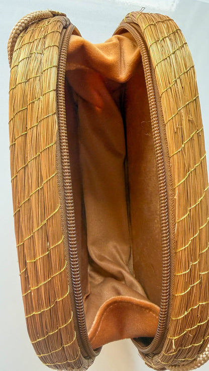 Close-up of lined interior on capim dourado crossbody bag detail
