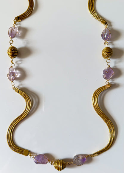 Close-up of Golden Grass necklace with amethyst gemstones 