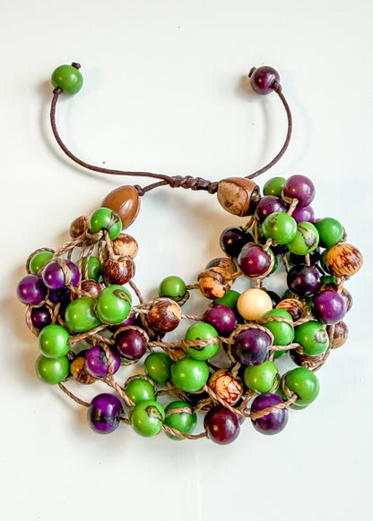 Handcrafted Brazilian Açaí seed bracelet with green purple and natural tones