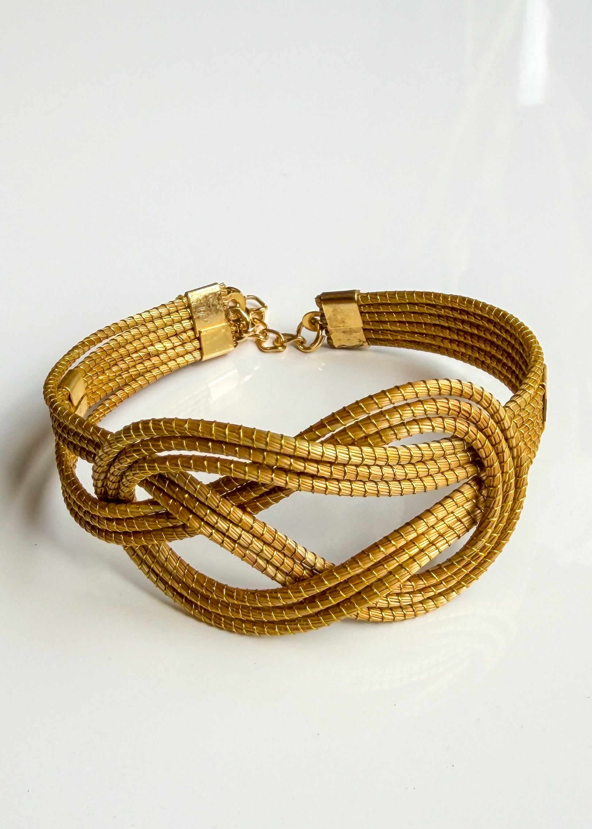 Side view of handcrafted Infinity Capim Dourado bracelet from Brazil