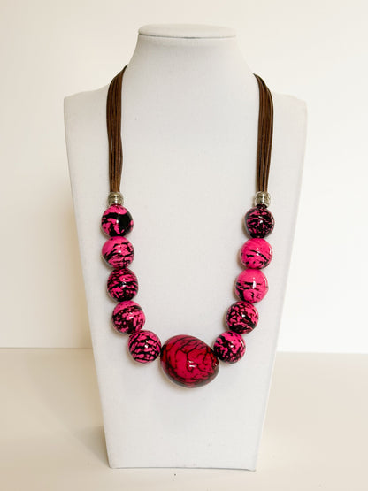 Pink jarina vegetable ivory and paxiúba seed necklace handmade by an Amazon artisan