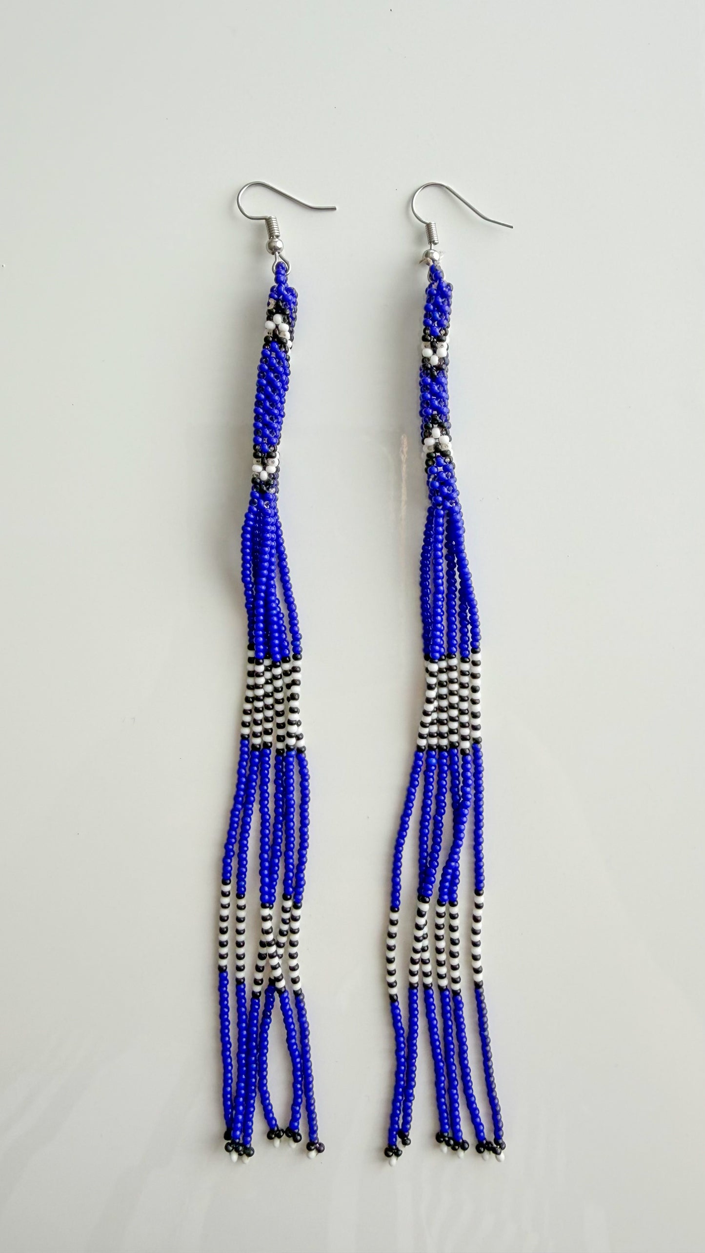 Wai Wai handmade beaded strand earrings in blue, white, and black recycled glass beads
