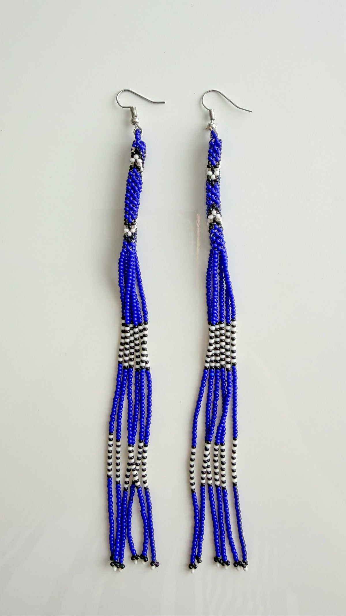Wai Wai handmade beaded strand earrings in blue, white, and black recycled glass beads