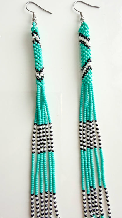 Close-up of turquoise recycled glass beadwork on 6.5 inch earrings