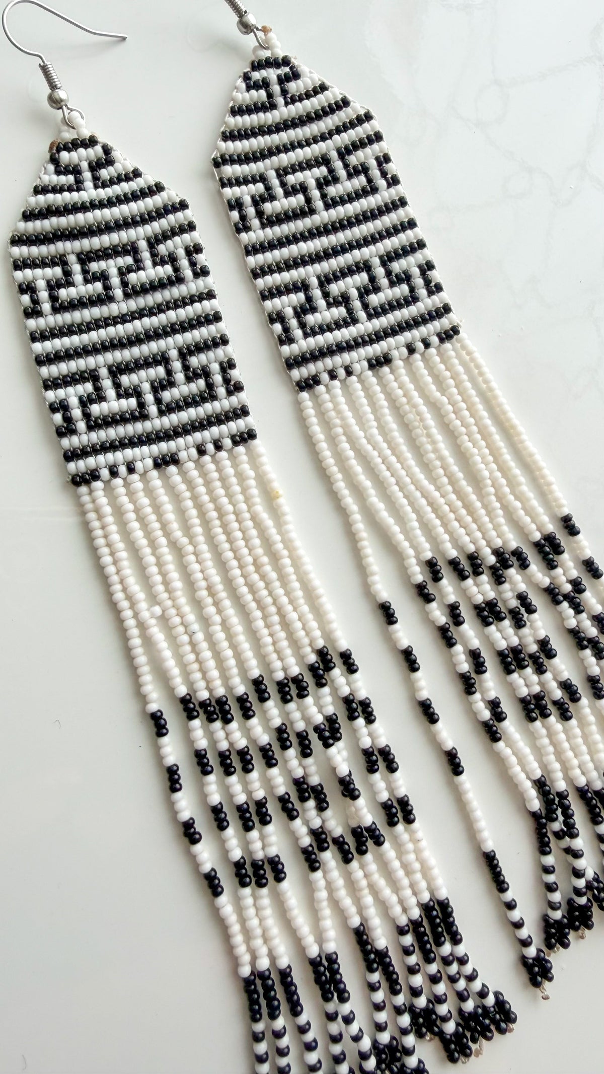 Close-up of recycled glass beadwork and fringe detail on 5.5 inch earrings