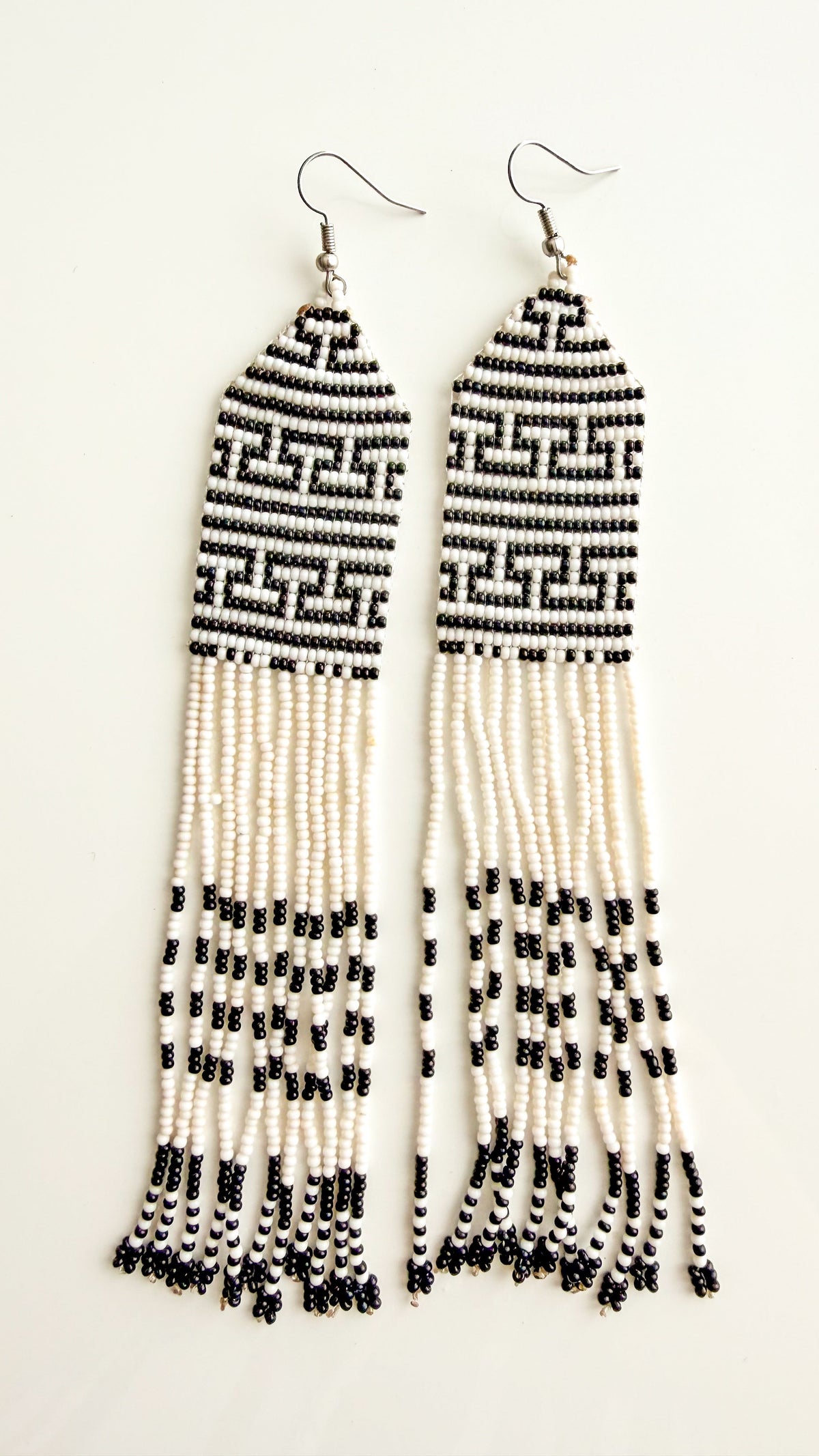 Wai Wai handmade meander fringe earrings in white and black recycled glass beads